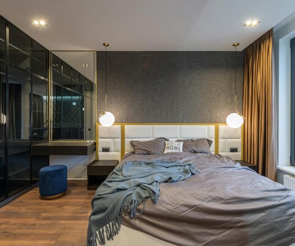 A calm and spacious studio with soft lighting and minimalist decor.